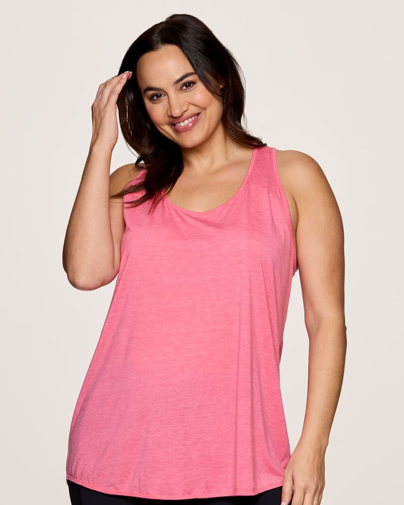 Front of a model wearing a size 1X Prime Relaxed Twist Back Tank Top in Pink by RBX Active. | dia_product_style_image_id:348427